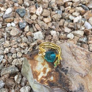 Gold branch ring with rhinestone accents…